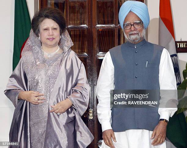 Bangladesh Prime Minister Begum Khaleda Zia and Indian Prime Minister Manmohan Singh pose for photographers before a delegation level meeting at the...