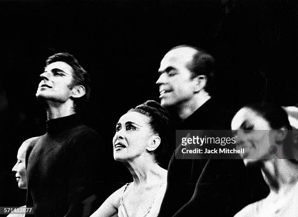 Modern dancer and choreographer Martha Graham takes a curtain call with dancers Bertram Ross and David Wood.