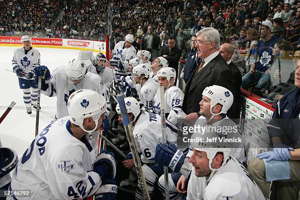 Head Coach Pat Quinn of the Toronto Maple Leafs talks to his players during their NHL game against the Vancouver Canucks at General Motors Place on...