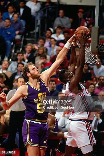 Mark Eaton#53 of the Utah Jazz goes up to block a shot against the Los Angeles Lakers during the NBA game at the L.A. Memorial Sports Arena circa...