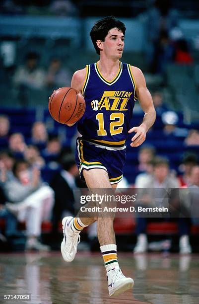 John Stockton of the Utah Jazz brings the ball upcourt during the NBA game circa 1986. NOTE TO USER: User expressly acknowledges and agrees that, by...