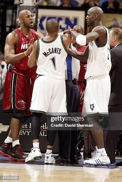 Rashad McCants of the Minnesota Timberwolves and Gary Payton of the Miami Heat both receive technical fouls in the fourth quarter on March 21, 2006...