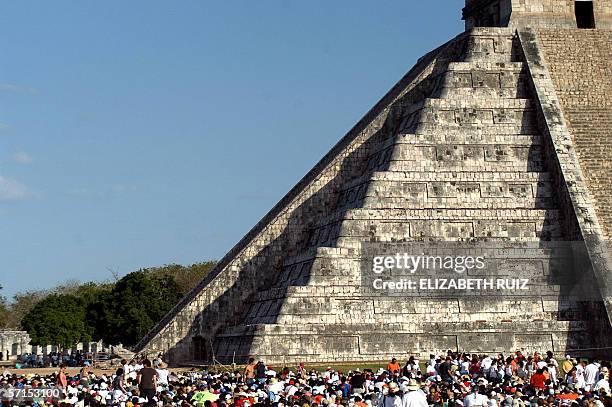 Thousands of tourists surround the Kukulkan Pyramid at the Chichen Itza archeologic site during the celebration of the Spring equinox 21 March, 2006...