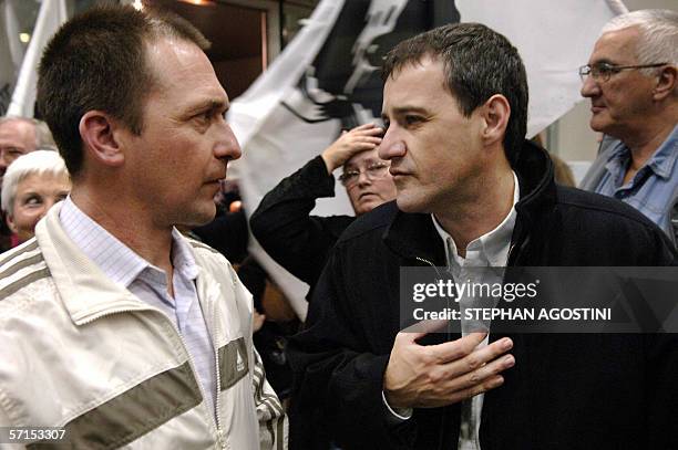 French Corsican militant Jean Castela speaks to other French Corsican militant Jean-Guy Talamoni , Regional Assembly representative, 21 March 2006...