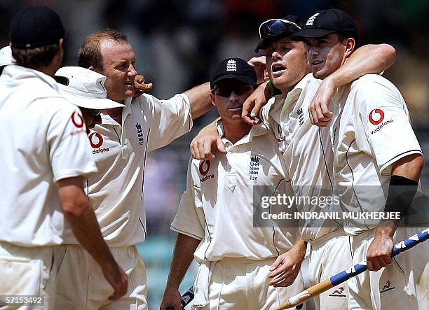 England cricket captain Andrew Flintoff and team-mates celebrate winning the third Test against India at the Wankhede stadium in Mumbai, 22 March...