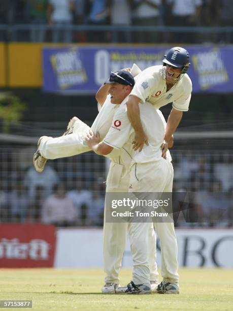 Andrew Flintoff of England lifts up Andrew Strauss of England after victory during day five of the Third Test Match between India and England at the...