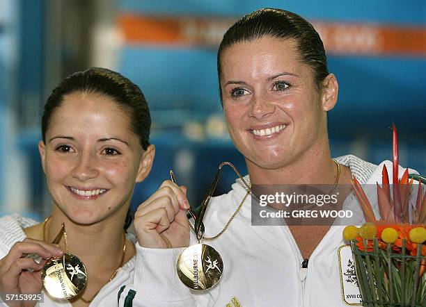 Loudy Tourky and Chantelle Newbery of Australia display their gold medals won for the women's 10m synchro platform diving at the Melbourne Sports and...