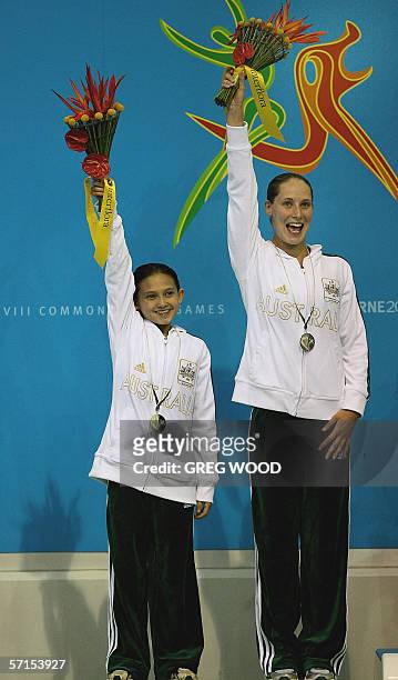 Melissa Wu and Alexandra Croak of Australia wave to spectators after receiving their bronze medals for the women's 10m synchro platform diving at the...