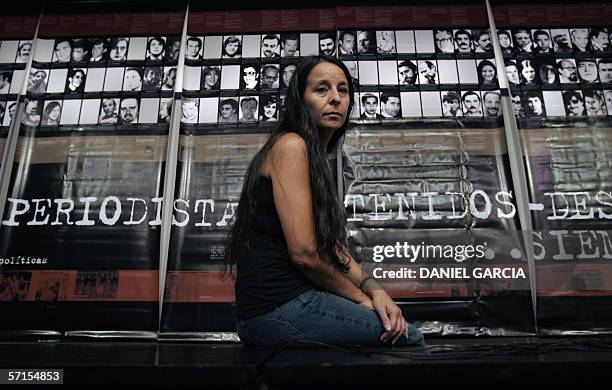 Buenos Aires, ARGENTINA: TO GO WITH AFP STORY Argentine journalist Ana Maria Careaga poses 07 March 2006 in Buenos Aires in front of a large placard...