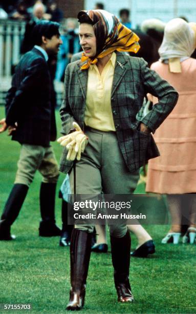 Queen Elizabeth ll walks around Windsor Horse Show,Windsor,England wearing riding gear in May of 1988.