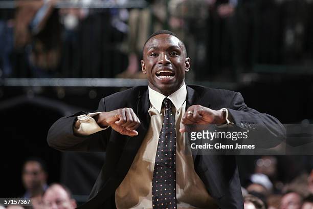 Head coach Avery Johnson of the Dallas Mavericks signals to his player from the sideline during a game against the Washington Wizards at American...