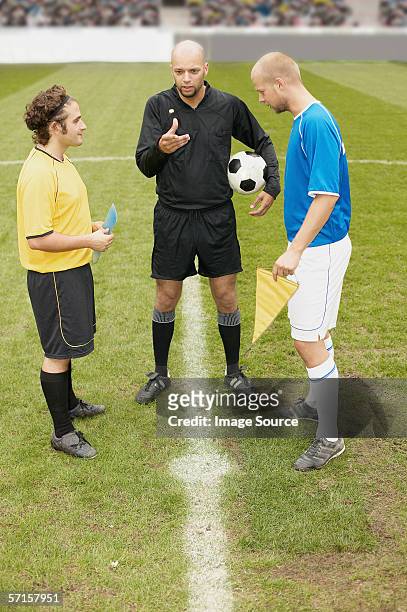 referee tossing a coin - flipping a coin stock pictures, royalty-free photos & images