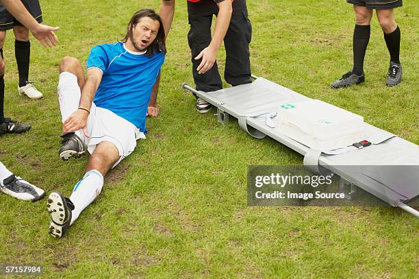 injured footballer - soccer injury stock-fotos und bilder