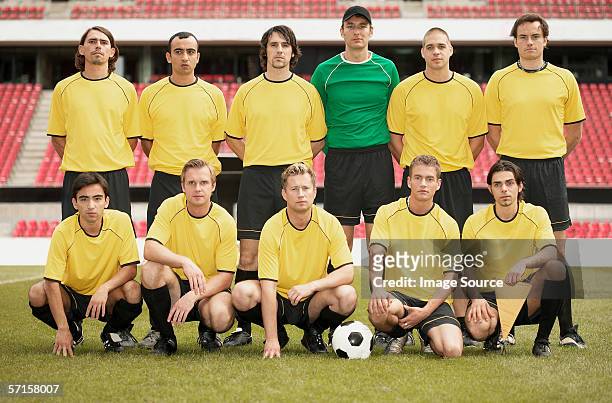 football team in yellow - soccer team stock pictures, royalty-free photos & images