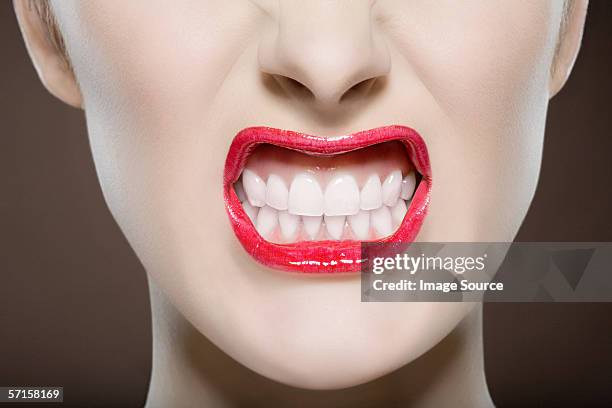 woman snarling - snarling stock pictures, royalty-free photos & images