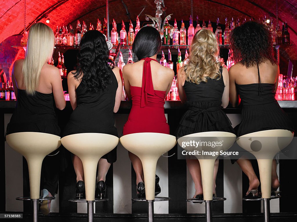 Five women sitting at bar