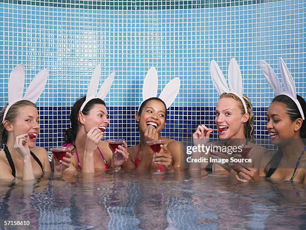 five women in hot tub - black cherries imagens e fotografias de stock