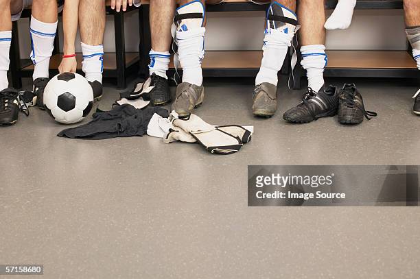 football team in changing room - シンガード ストックフォトと画像