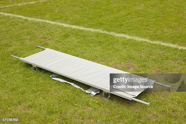 stretcher on football pitch - stretcher stock-fotos und bilder