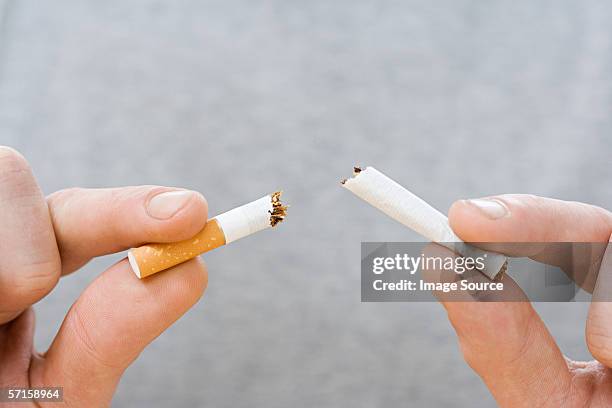 breaking the habit - broken cigarette stock pictures, royalty-free photos & images