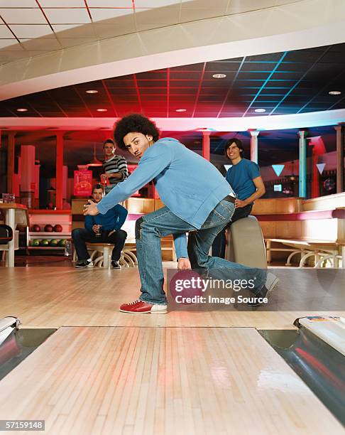 young man bowling - bowling ball stock pictures, royalty-free photos & images