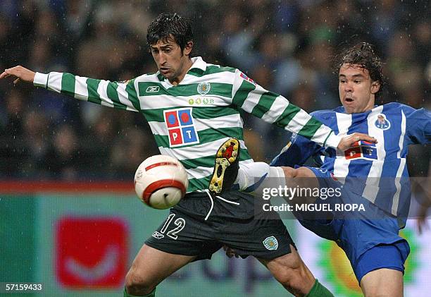 Porto's Brazilian Adriano Louzada and Sporting CP's Marco Caneira fight for the ball during their Portuguese Cup semifinal football match at Dragao...