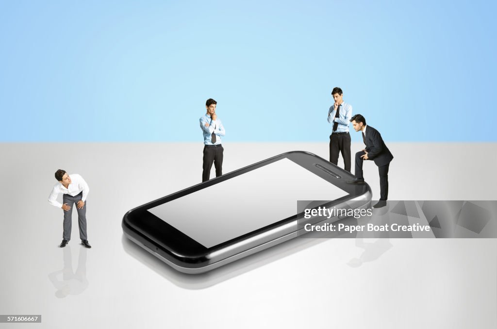 Group of businessmen looking at a