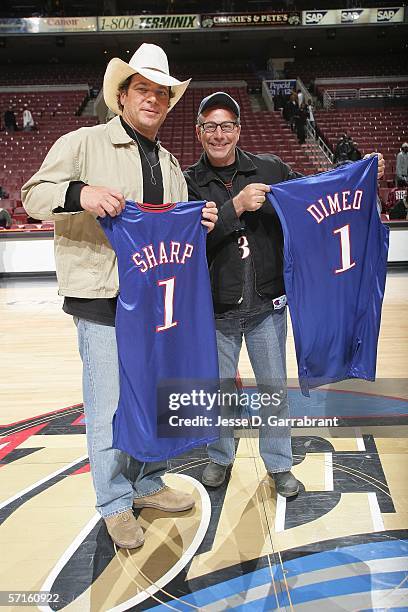 Extreme Makeover: Home Edition Design Team members Paul Dimeo and Preston Sharp receive jersey's during halftime at the game between the Philadelphia...