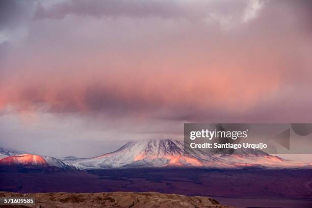 sunset rays hit cordillera domeyko during a storm - cordillera-administrative-region stock pictures, royalty-free photos & images