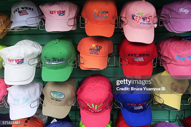 colorful souvenir caps - pet stockfoto's en -beelden