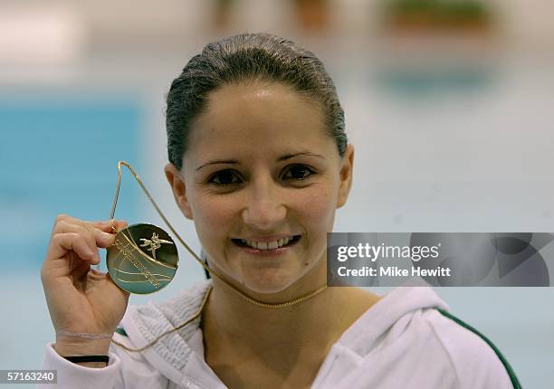Loudy Tourky of Australia proudly displays the Gold medal won during the Women's 10m Platform Final during the diving at the Melbourne Sports &...