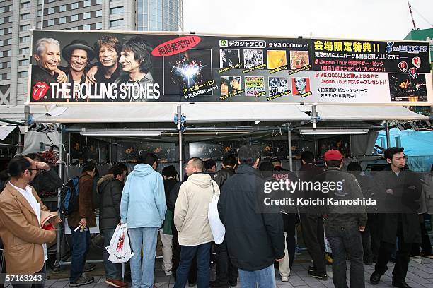 Japanese fans buy Rolling Stones merchandise before their concert at Tokyo Dome on March 22, 2006 in Tokyo, Japan. The group are to play in 5 cities...