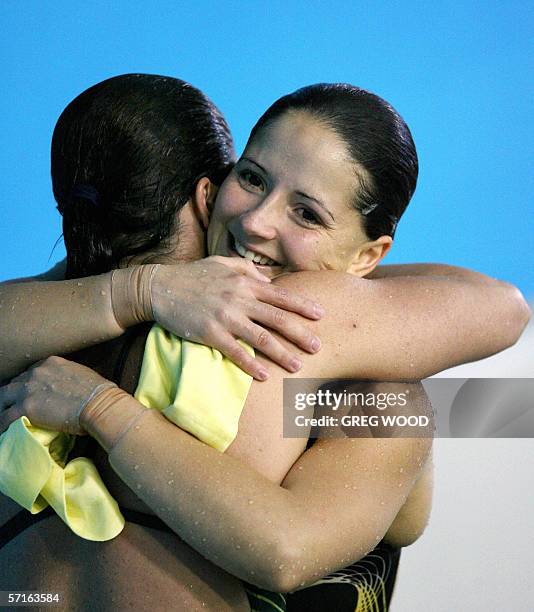 Australia's Loudy Tourky hugs compatriot Chantelle Newbery after winning the Commonwealth Games women's 10m platform final at the Melbourne Sports...