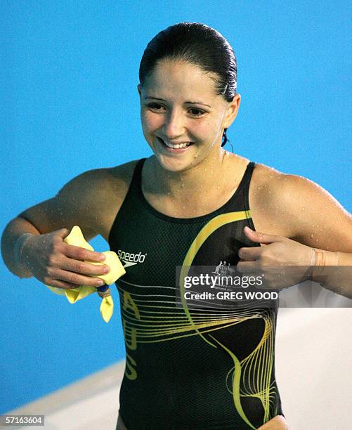 Australia's Loudy Tourky smiles after completing her last dive to win gold for the Commonwealth Games women's 10m platform final at the Melbourne...