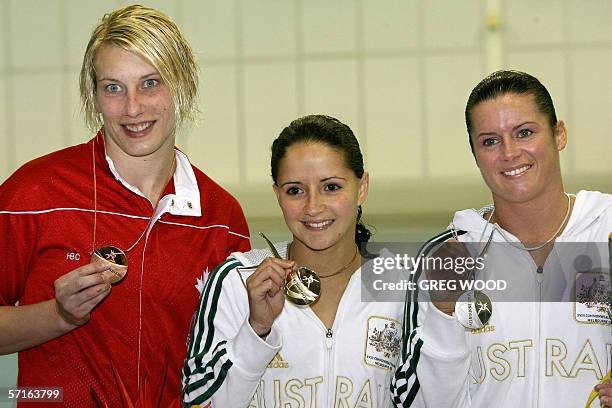 Australia's Loudy Tourky with compatriot Chantelle Newbery and Canada's Emilie Heymans display their medals won for the Commonwealth Games women's...