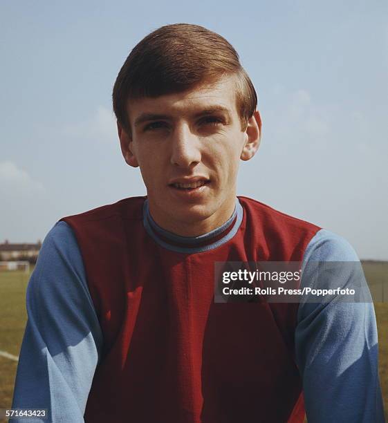 English footballer and midfielder with West Ham United, Martin Peters posed wearing West Ham team kit in August 1966.
