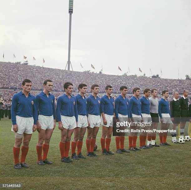 The Yugoslavia national football team line up on the pitch before an international friendly game against West Germany on 23rd June 1966. From left to...