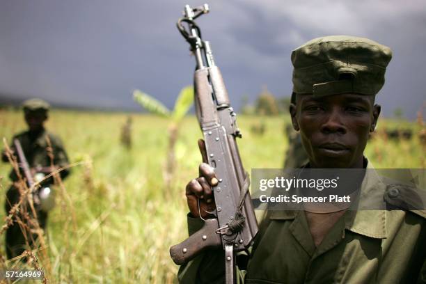 Soldiers, the national army of the Democratic Republic of Congo, stand together as they participate in training exercises March 23, 2006 in Bunia,...