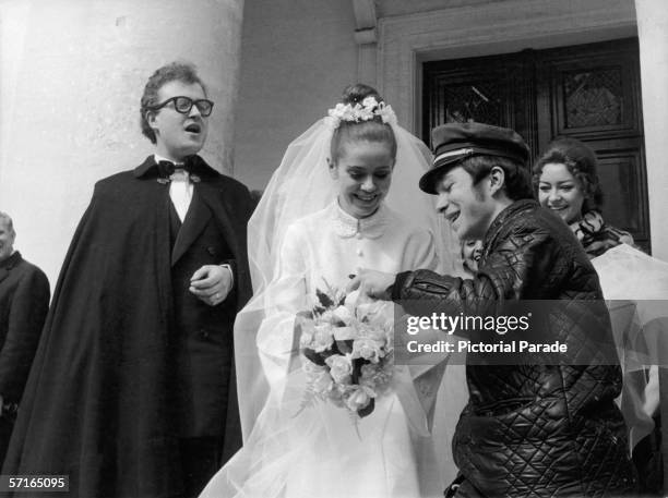 Telegram deliverer delivers a telegram to newly married French poetess Minou Drouet as her new husband, singer and actor Patrick Font stands next to...