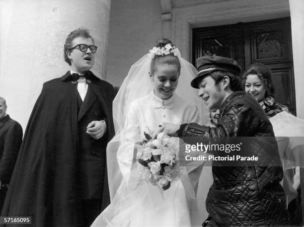 Telegram deliverer delivers a telegram to newly married French poetess Minou Drouet as her new husband, singer and actor Patrick Font stands next to...