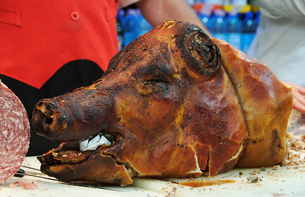 charcoal pork at a market in impruneta - impruneta foto e immagini stock
