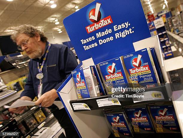 Best Buy employee walks past a display for TurboTax software in a Best Buy store March 23, 2006 in Niles, Illinois. As next month's income tax...