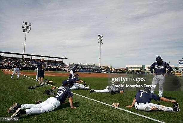 Members of the San Diego Padres stretch before a Spring Training Cactus League game against the Kansas City Royals on March 23, 2006 at the Peoria...