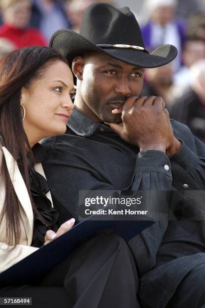 Retired power-foward Karl Malone listens at the unveiling of the statue commissioned by the Utah Jazz owner Larry H. Miller on March 23, 2006 at the...