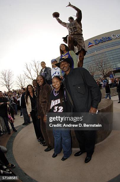 Retired power forward Karl Malone and his family pose at the unveiling his statue commissioned by Utah Jazz owner Larry H. Miller on March 23, 2006...