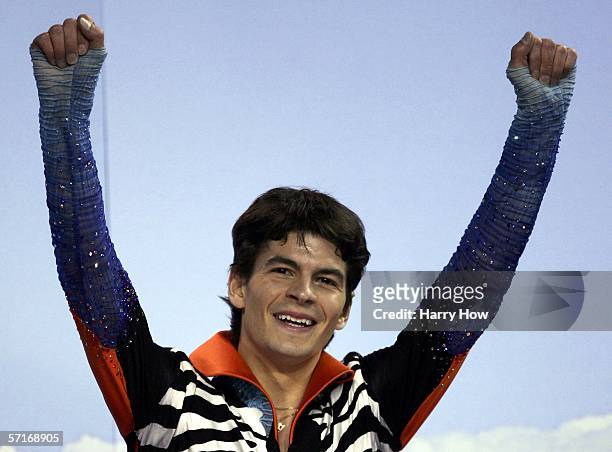 Stephane Lambiel of Switzerland raises his arms to celebrate his gold medal victory in the Men's Free Skating during the ISU World Figure Skating...