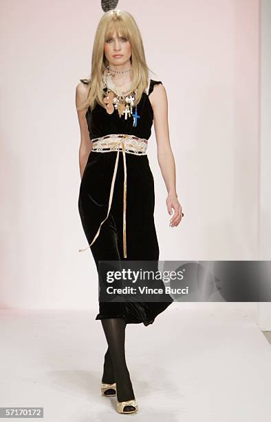 Model walks the runway at the Meghan Fall 2006 show during the Mercedes Benz Fashion Week at Smashbox Studios on March 23, 2006 in Culver City,...