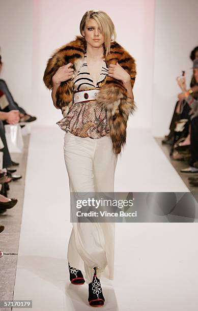 Model walks the runway at the Meghan Fall 2006 show during the Mercedes Benz Fashion Week at Smashbox Studios on March 23, 2006 in Culver City,...