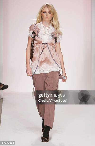 Model walks the runway at the Meghan Fall 2006 show during the Mercedes Benz Fashion Week at Smashbox Studios on March 23, 2006 in Culver City,...