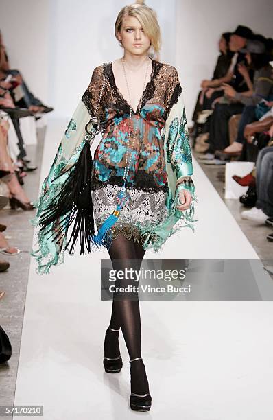 Model walks the runway at the Meghan Fall 2006 show during the Mercedes Benz Fashion Week at Smashbox Studios on March 23, 2006 in Culver City,...